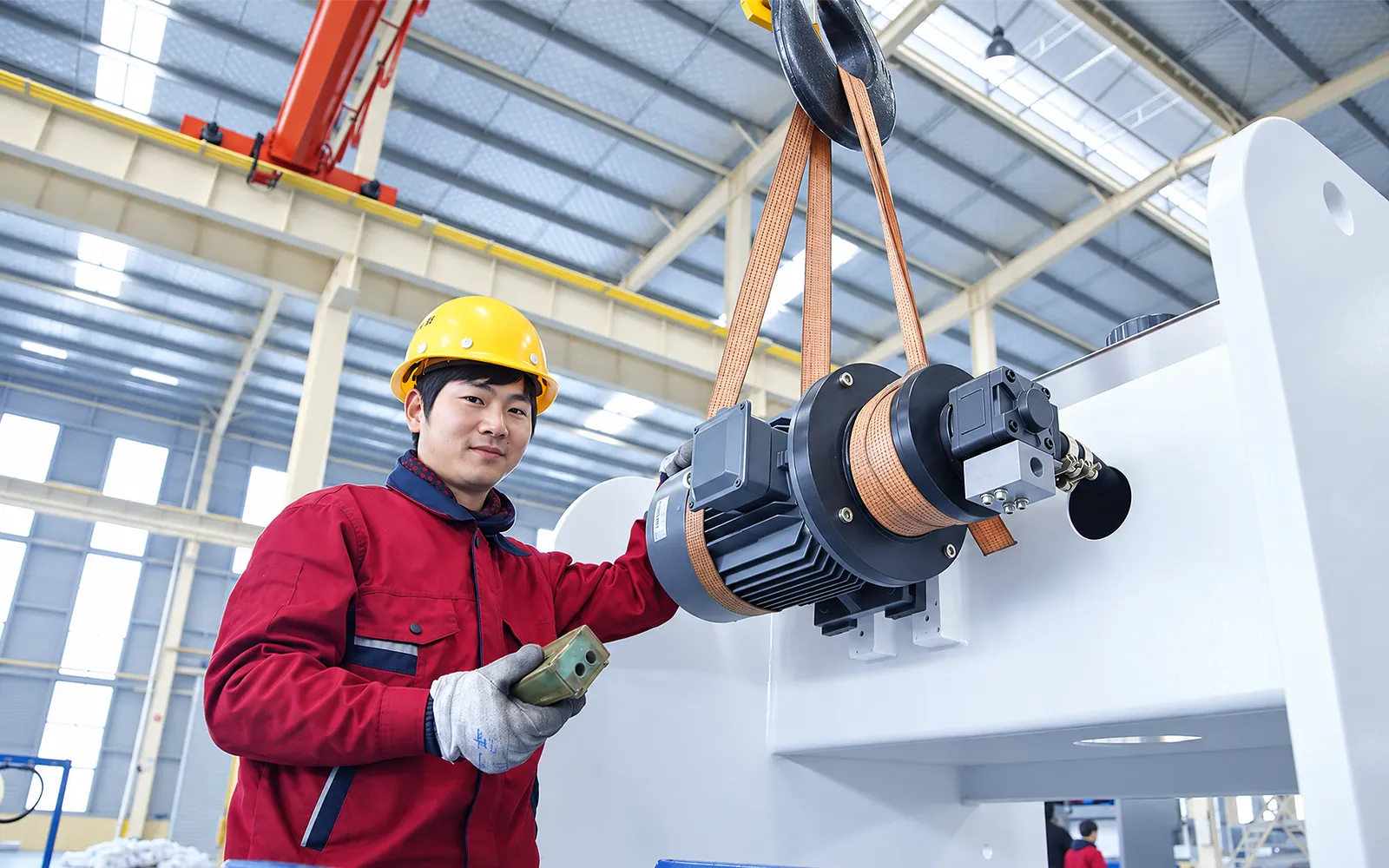 Technician working on a machine drive assembly