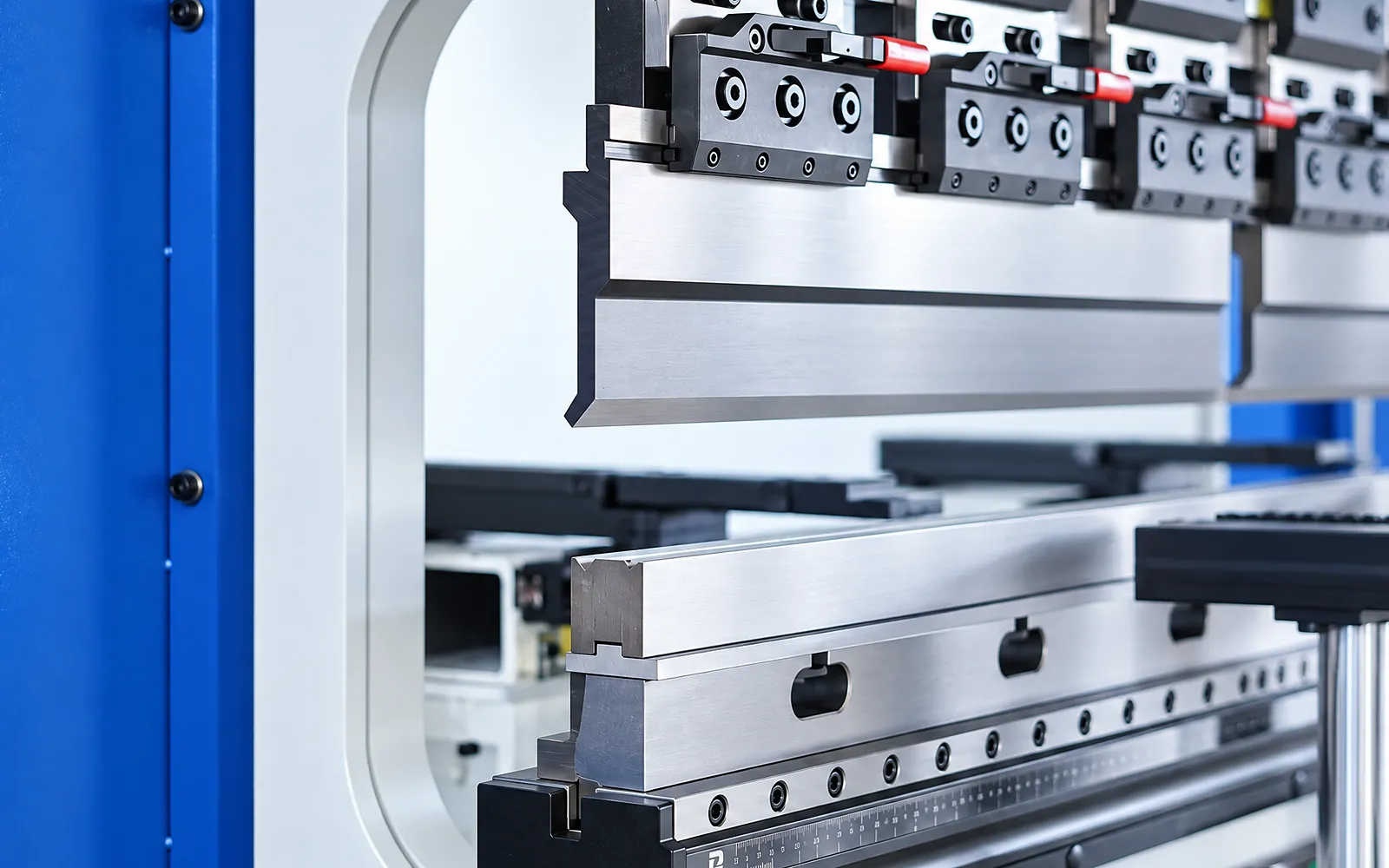 Press-brake upper and lower tooling with the working opening visible