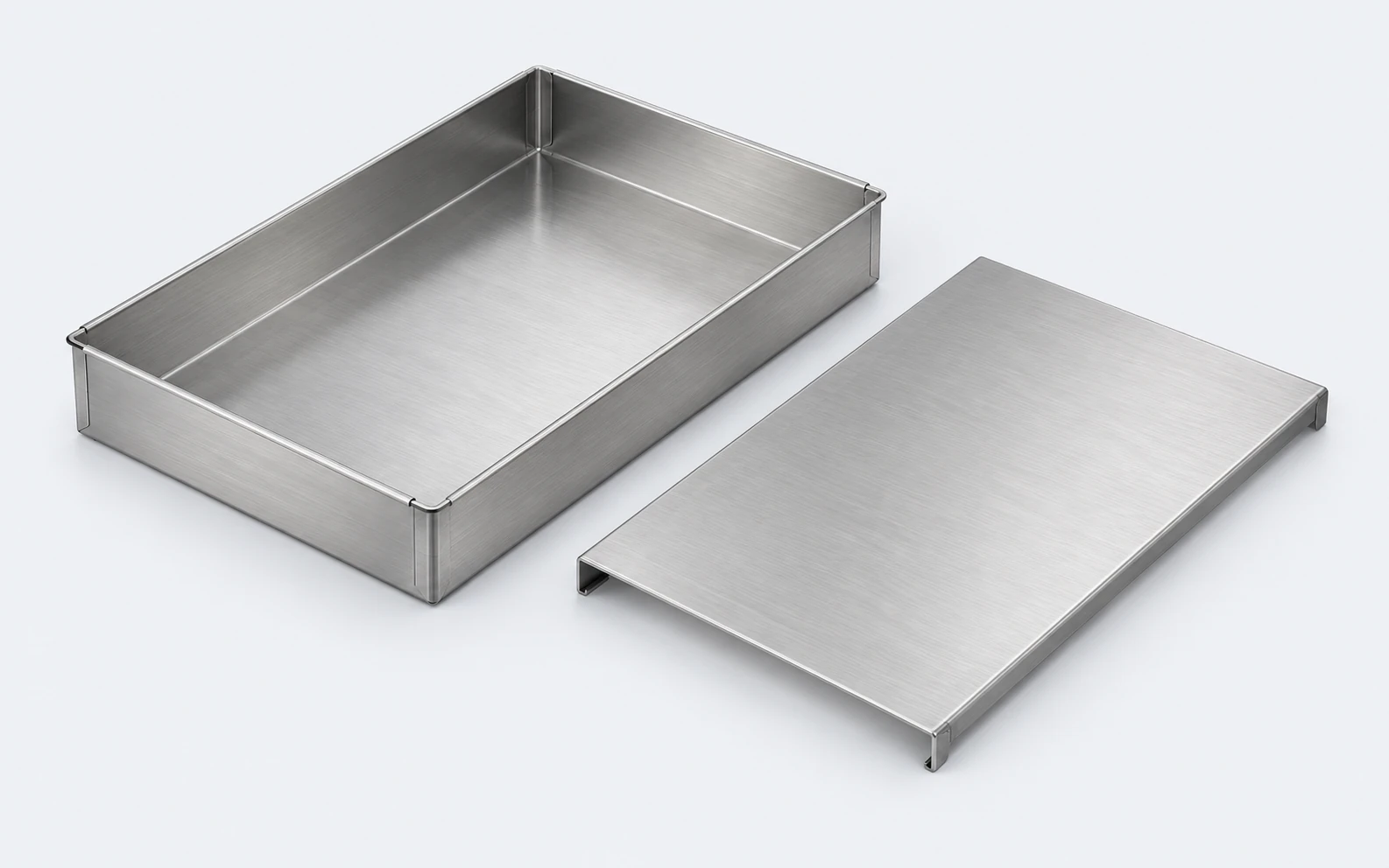 Illustration of a stainless-steel tray with joined corners and a separate folded-edge shelf.
