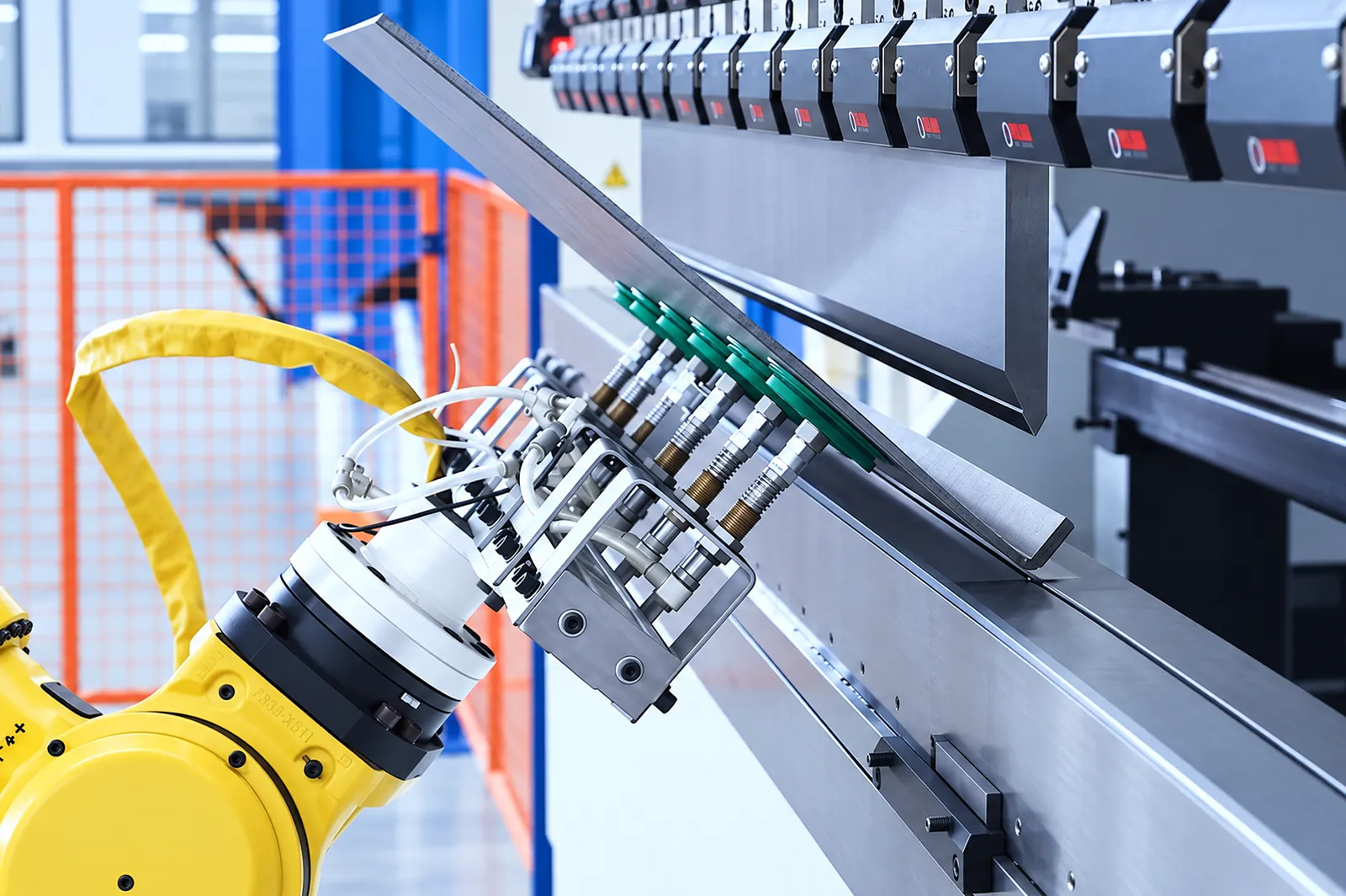 Robot following a sheet-metal part during bending