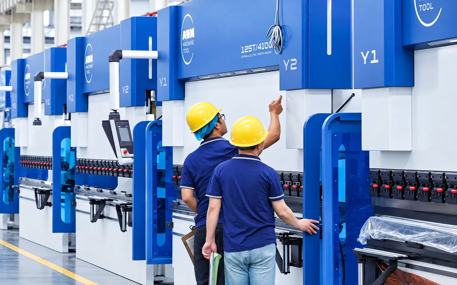 Technicians working at an ADH press brake